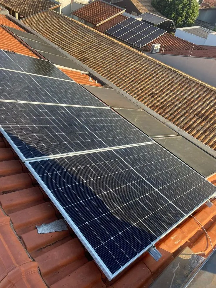 Solar panels installed on a clay tile roof